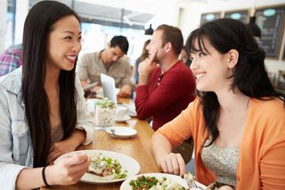 Two women eat lunch at a restuarant