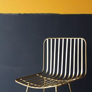 yellow and black paint with chair