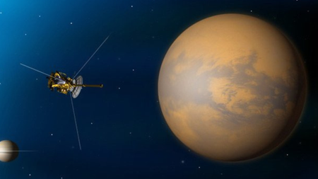 An illustration of Cassini making a flyby of Saturn's moon Titan