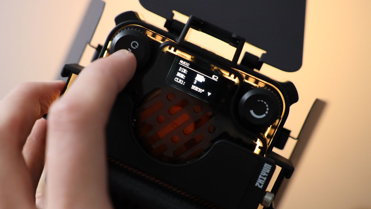 Zhiyun FIVERAY M20C LED panel held in a hand