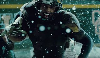 Ray Fisher as Victor Stone playing football in Justice League