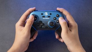 The Blue GameSir Super Nova being held in a marketing image