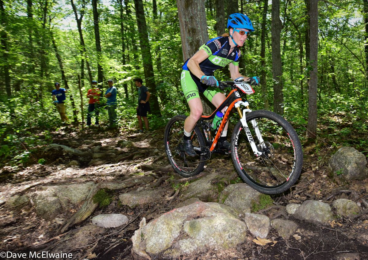 Kimberley Quinlan (Bicycle Express) riding a rock garden on lap one