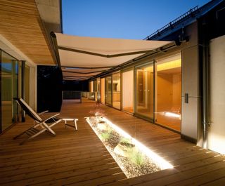 awning ideas: cover over decking on modern plot