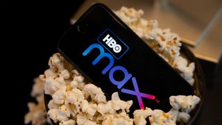 HBO Max app on a smartphone in a popcorn bucket
