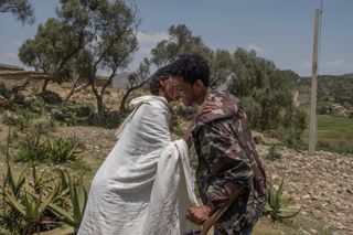 A young man greets his mother for the first time since he joined the Tigray Defense Forces two years earlier in Saesie Tsada, Ethiopia