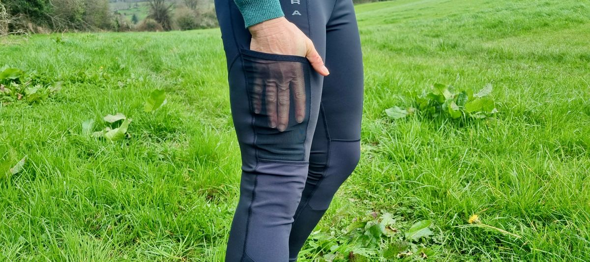 Endura SingleTrack Leggings being worn in a grassy field