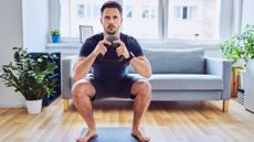 Man doing a kettlebell squat