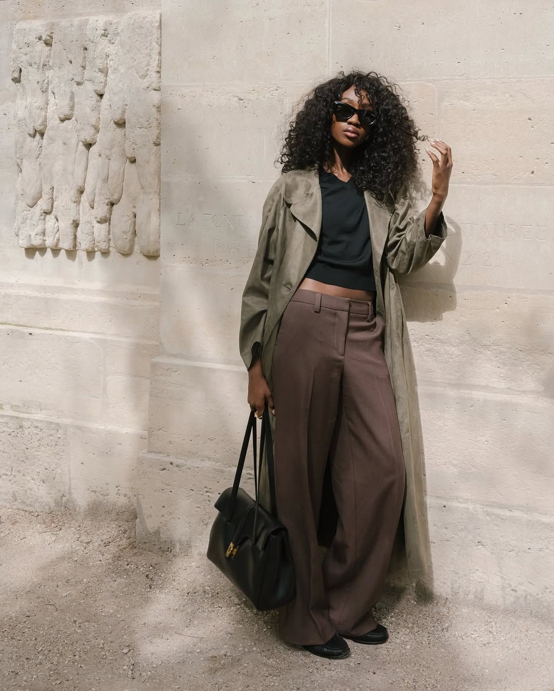 Emmanuelle wearing trench coat