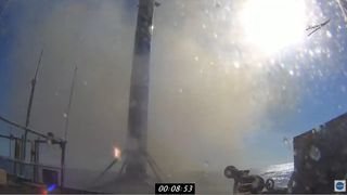 A SpaceX Falcon 9 rocket booster is seen after a successful landing on the drone ship Of Course I Still Love You in the Atlantic Ocean following the launch of NASA's CRS-21 resupply mission to the International Space Station on Dec. 6, 2020.