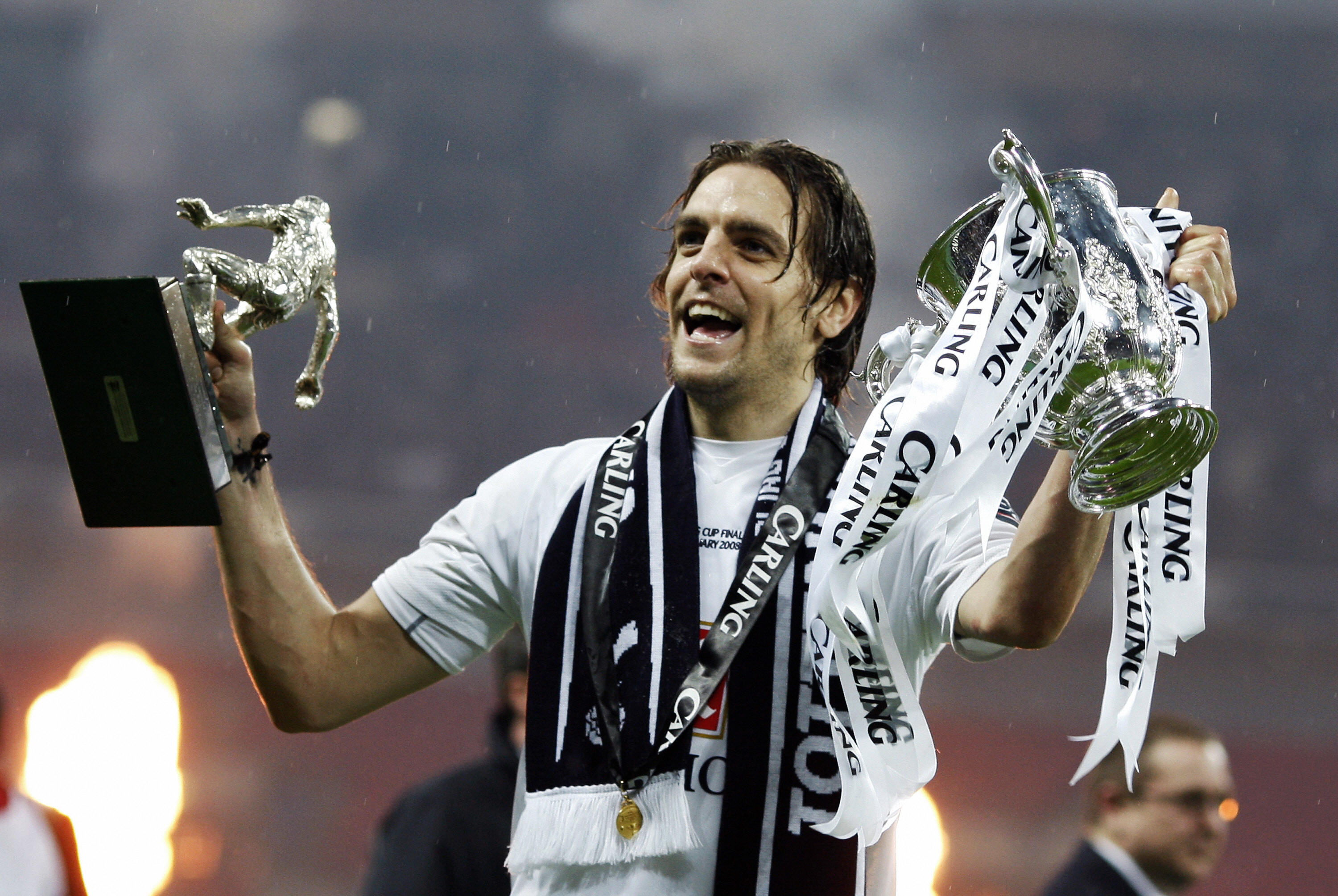 Jonathan Woodgate celebrates with the League Cup and his Man of the Match trophy after his extra-time winner for Tottenham against Chelsea in the 2008 final.