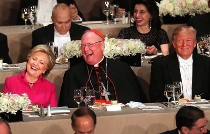 Donald Trump and Hillary Clinton share a table at the Al Smith memorial dinner