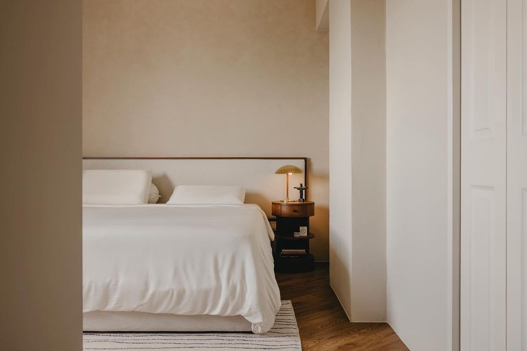 Limewashed bedroom with bed