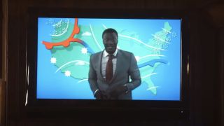 Aldis Hodge pretending to report the weather on Leverage