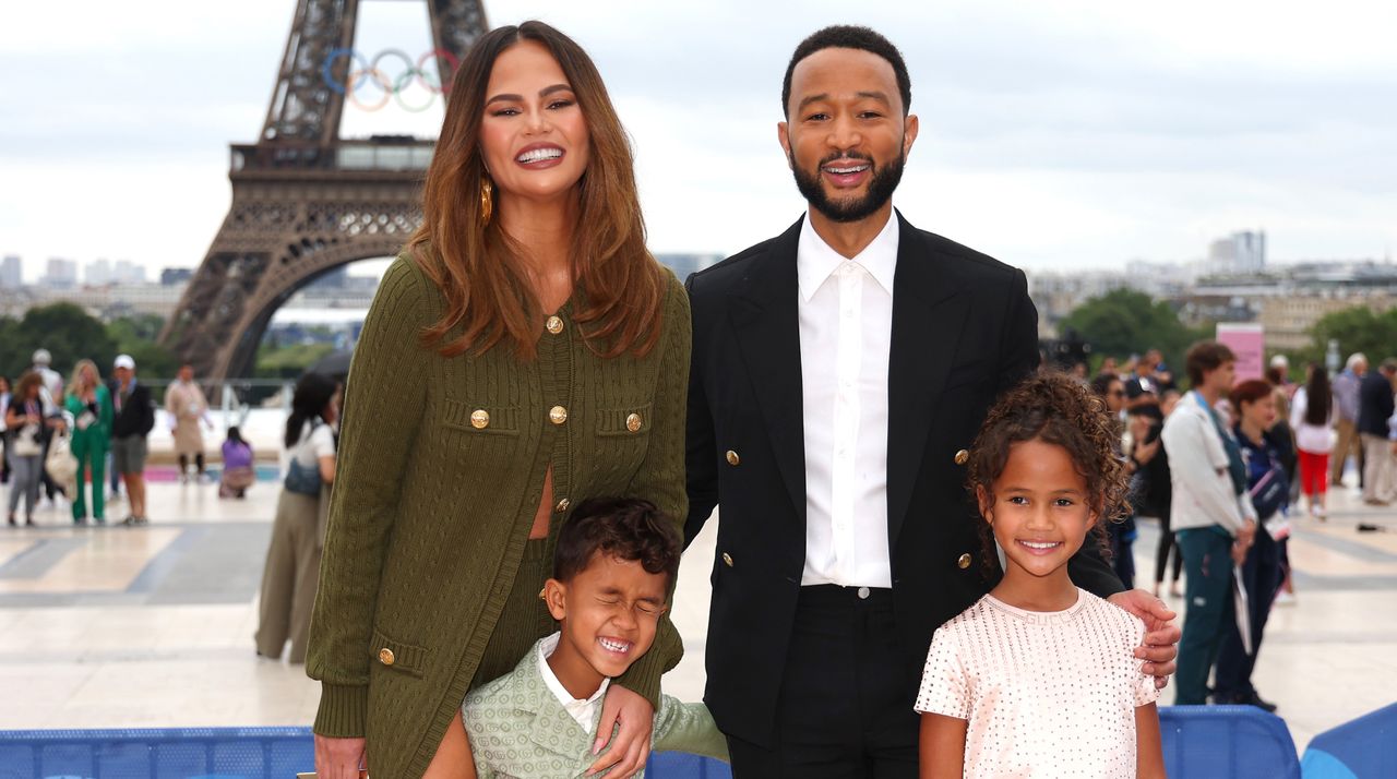 Chrissy Teigen and John Legend attend with son Miles and daughter Luna the red carpet ahead of the opening ceremony of the Olympic Games Paris 2024 on July 26, 2024 in Paris, France.