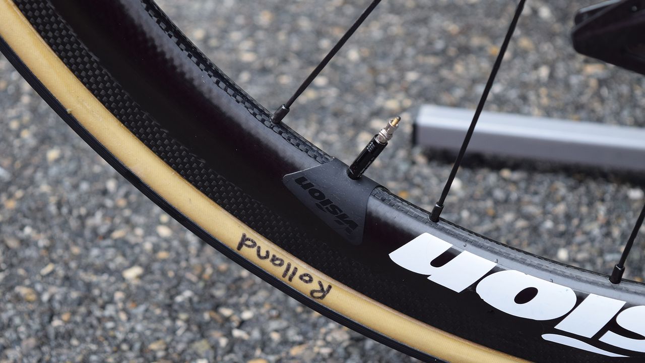 Neat adhesives from Vision prevent any valve rattle, while Rolland's tyres and wheels are both labelled up for the French rider