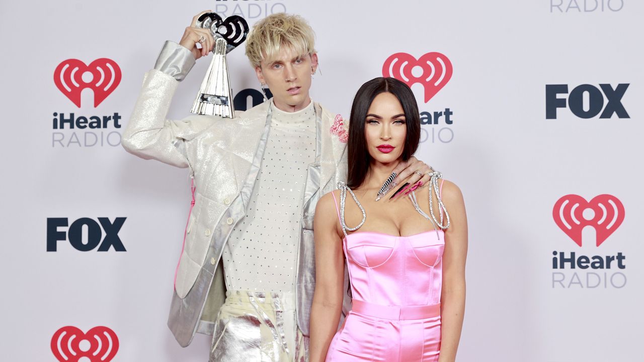 los angeles, california may 27 editorial use only l r machine gun kelly, winner of the alternative rock album of the year award for tickets to my downfall,’ and megan fox attend the 2021 iheartradio music awards at the dolby theatre in los angeles, california, which was broadcast live on fox on may 27, 2021 photo by emma mcintyregetty images for iheartmedia