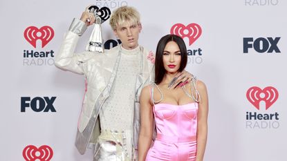 los angeles, california may 27 editorial use only l r machine gun kelly, winner of the alternative rock album of the year award for tickets to my downfall,’ and megan fox attend the 2021 iheartradio music awards at the dolby theatre in los angeles, california, which was broadcast live on fox on may 27, 2021 photo by emma mcintyregetty images for iheartmedia