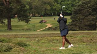 Genelle Aldred hits an iron shot