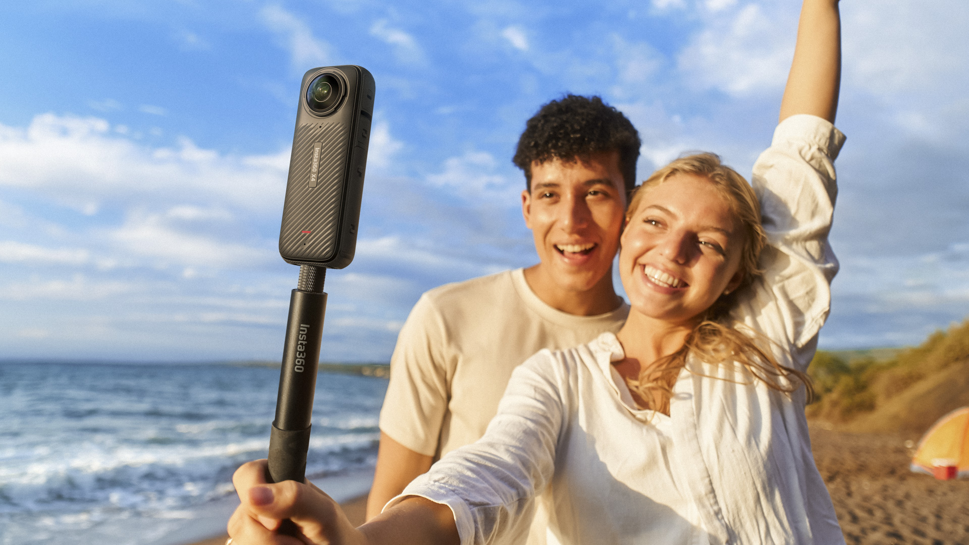 Two people recording a selfie at sunrise with theInsta360 X4 360 degree camera