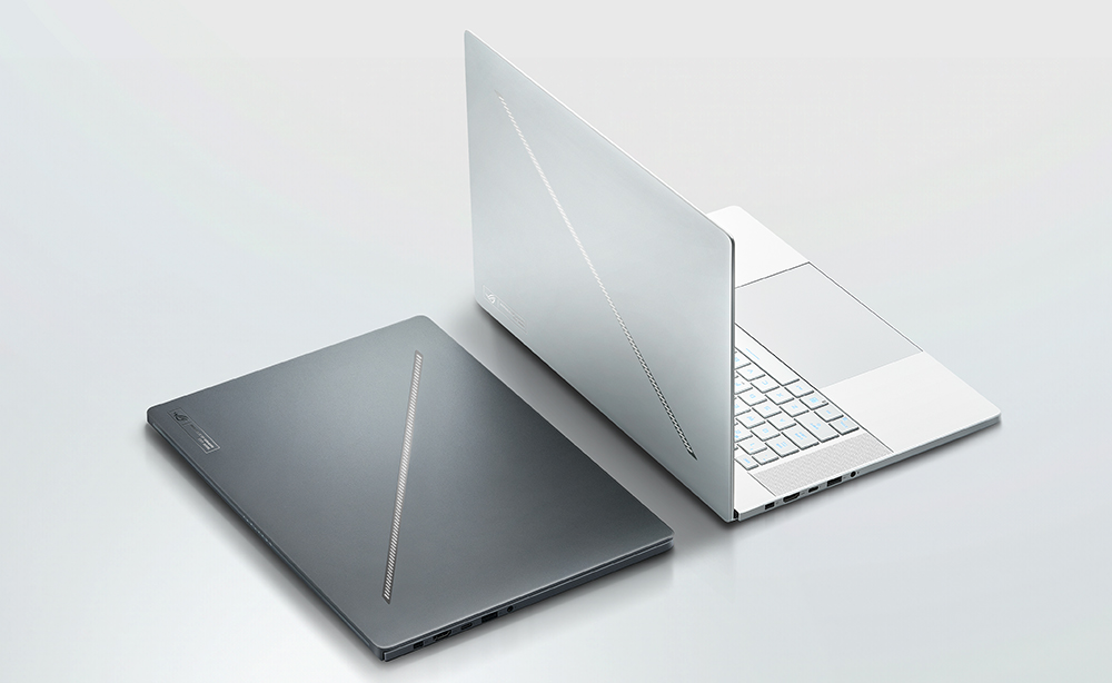 Two ASUS Zephyrus laptops on a shiny table