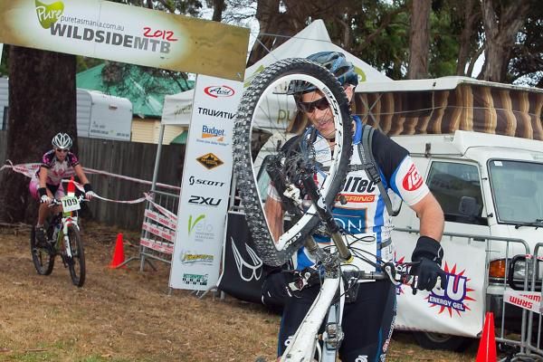 Launceston's Jonty Barnett manged to completely buckle a wheel on the final stage and walked his bike across the line in Strahan.