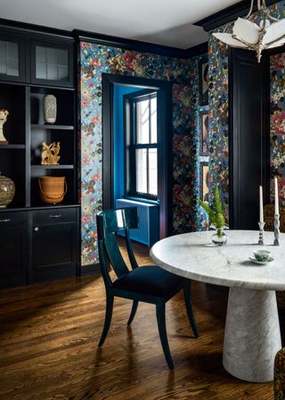 A dining room with open cabinetry