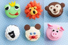 Animal fairy cakes including pig, monkey, lion and frog