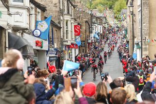 The peloton descends through a Yorkshire town