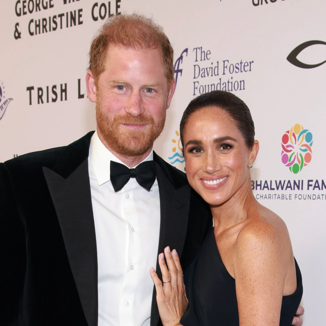 Meghan Markle wears a long black dress with Princess Diana's butterfly earrings