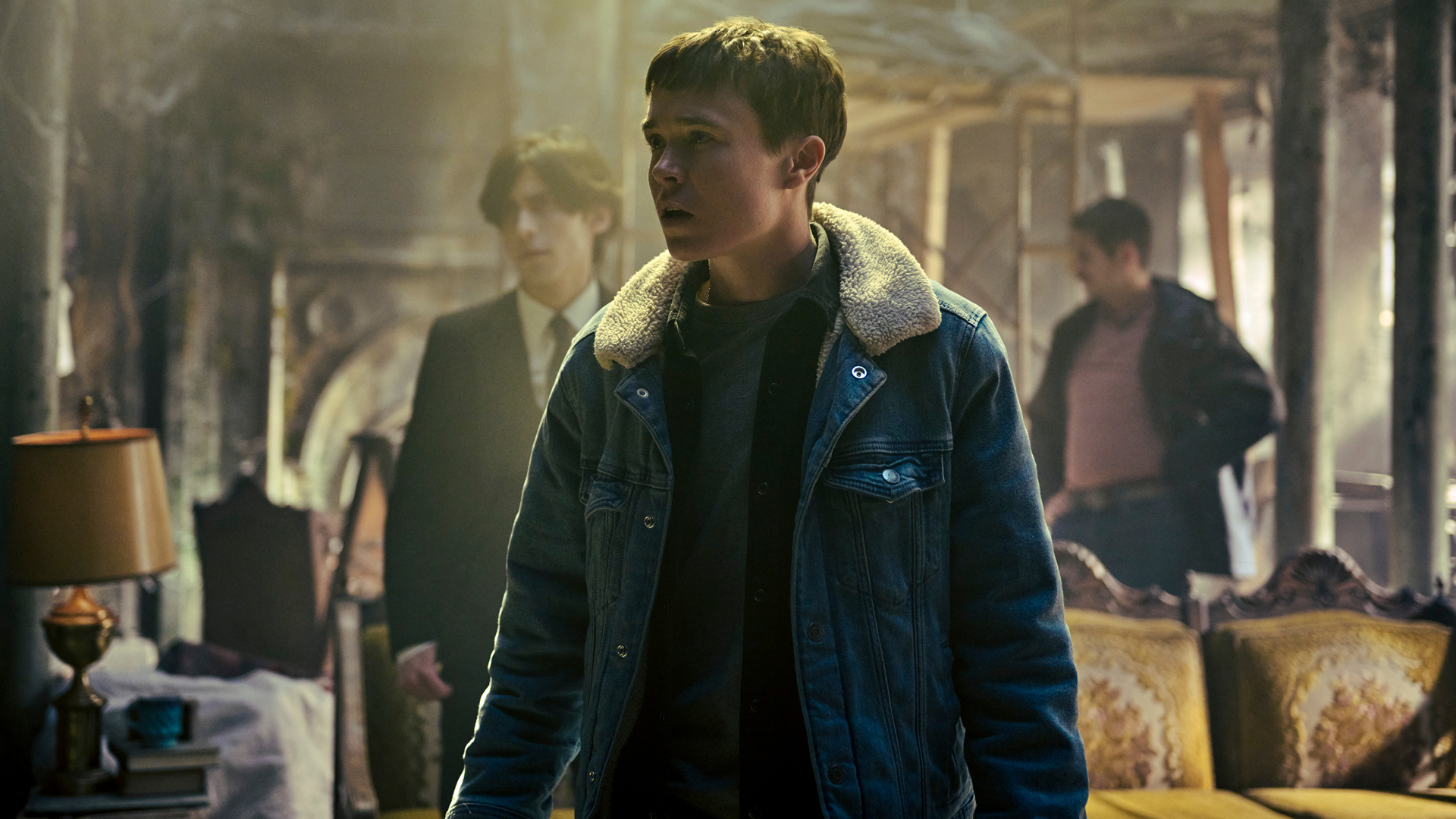 Viktor, Five and Diego inspect their ruined house in The Umbrella Academy season 4