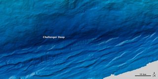 Challenger Deep in the Mariana Trench is the deepest spot on Earth. The spot was estimated in 2014 to plunge to 36,037 feet (10,984 m) beneath the Western Pacific Ocean.