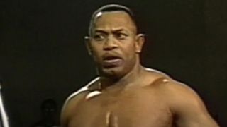 2 Cold Scorpio look at referee during match at ECW's Cyber Slam '96