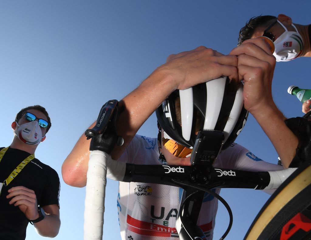 Stage winner Team Jumbo rider Team UAE Emirates rider Slovenias Tadej Pogacar rests after crossing the finish line at the Grand Colombier pass during the 15th stage of the 107th edition of the Tour de France cycling race 175 km between Lyon and Grand Colombier on September 13 2020 Photo by Stephane MANTEY various sources AFP Photo by STEPHANE MANTEYAFP via Getty Images