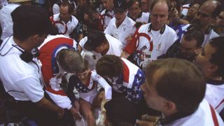 23 jul 1996 kerri strug of the usa receives attention from us officials after injuring her leg during the team gymnastic competition at the georgia dome at the 1996 centennial olympic games in atlanta, georgia mandatory credit mike powell allsport