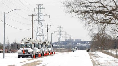 Pike Electric service trucks line up after a snow storm on Feb. 16, 2021, in Fort Worth, Texas.