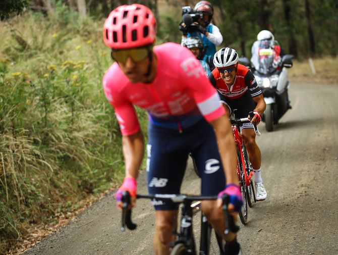 Trek-Segafredo's Richie Porte grits his teeth as he digs deep to stay with Michael Woods on the gravel climb