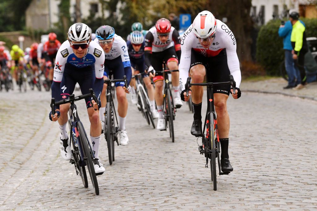 NOKERE BELGIUM MARCH 16 LR Mauro Schmid of Switzerland and Team QuickStep Alpha Vinyl and Max Walscheid of Germany and Team Cofidis compete during the 76th Danilith Nokere Koerse 2022 Mens Elite a 1898km one day race from Deinze to Nokere NokereKoerse DNK22 on March 16 2022 in Nokere Belgium Photo by Luc ClaessenGetty Images