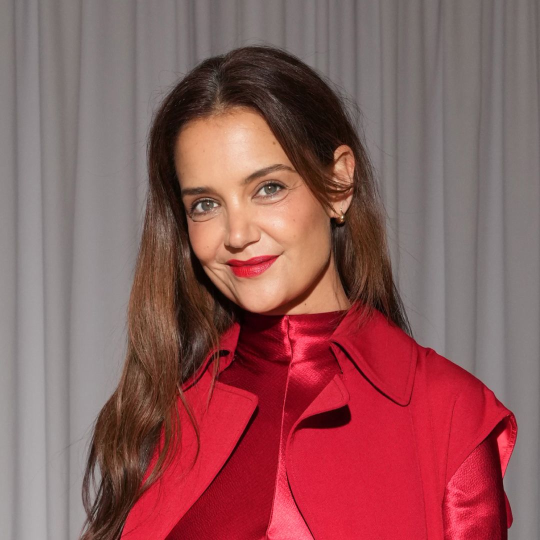 Katie Holmes weres a bright red long-sleeve gown to attend the FFORME S/S26 Show during New York Fashion Week on September 12, 2025