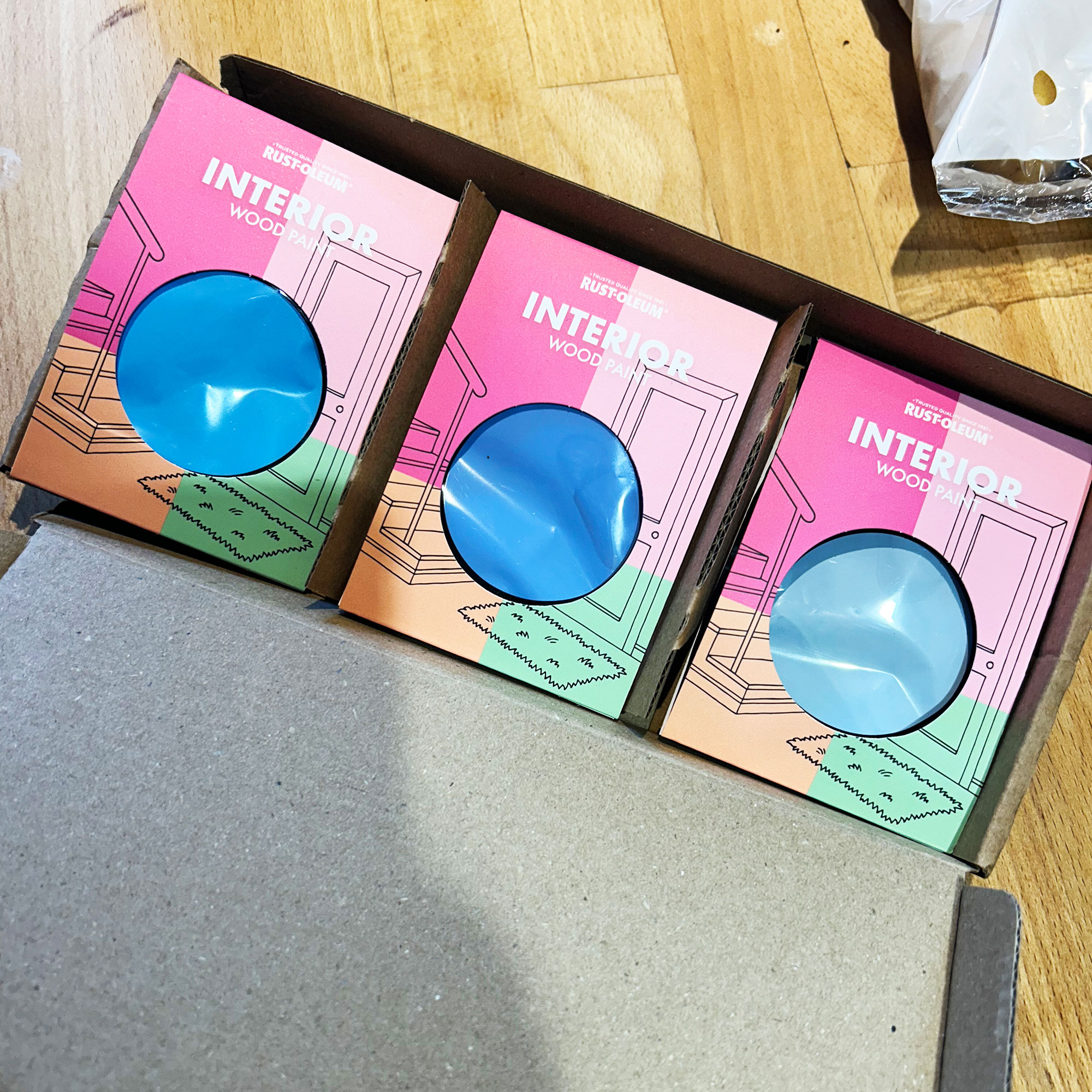 Three boxes of blue wood paint