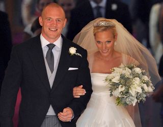 Mike Tindall (L) and his new bride Britain's Zara Phillips in 2011