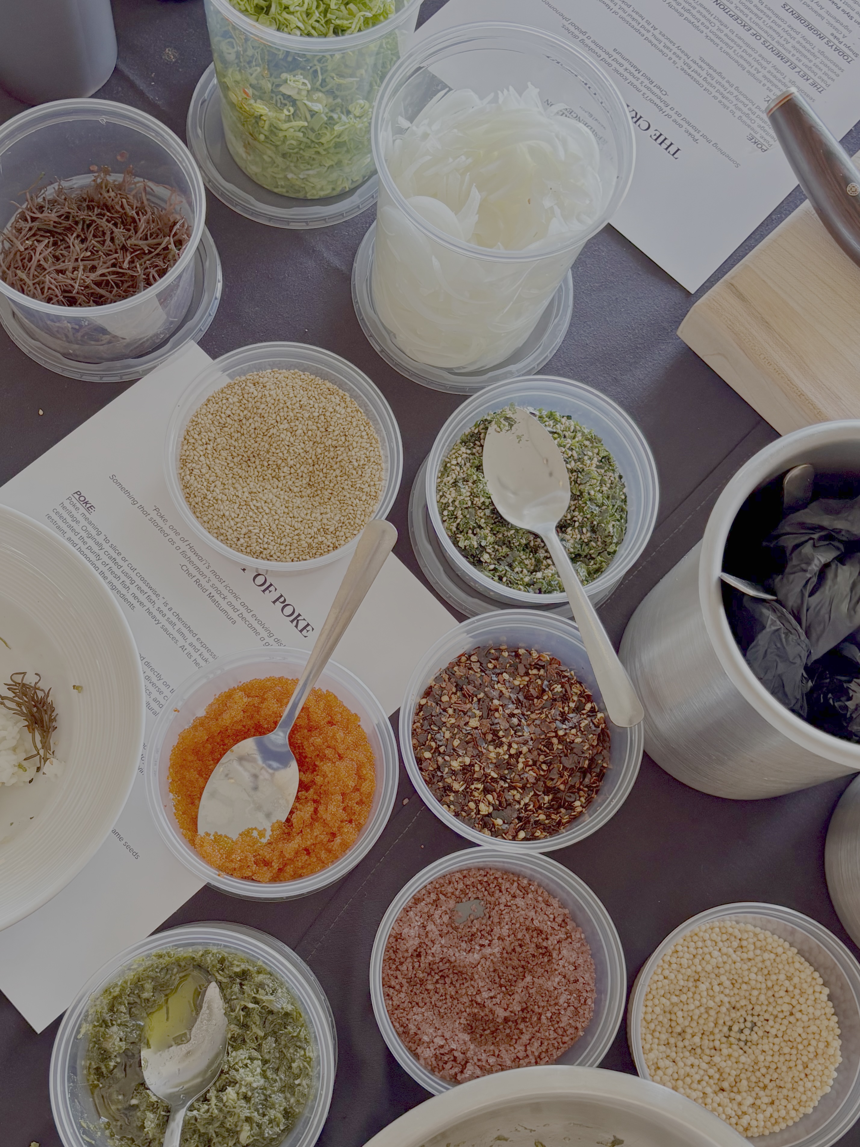 Ingredients and seasonings laid out for a poke-making class.