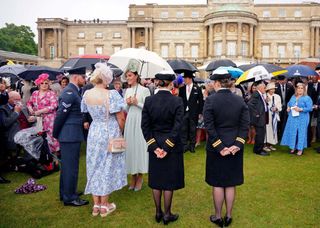 Britain's Catherine, Duchess of Cambridge meets with guests at a Royal Garden Party at Buckingham Palace in London on May 25, 2022