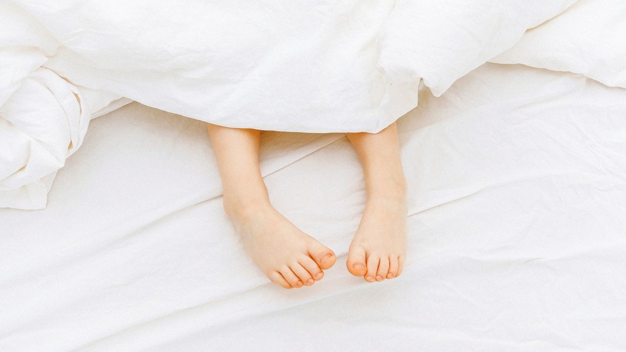 Feet poking out from under sheets