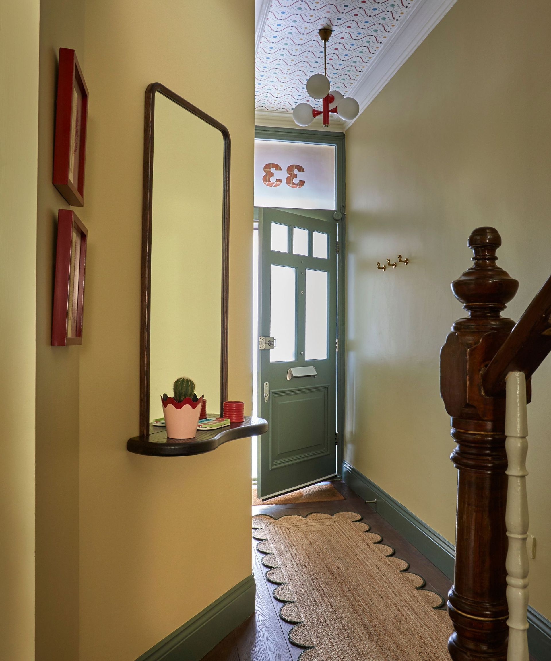 yellow and green hallway with jute rug
