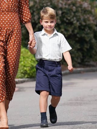 Prince Louis attends school wearing navy shorts and a white shirt, Michael Middleton attends Wimbledon with Kate Middleton's mom, Carole Middleton