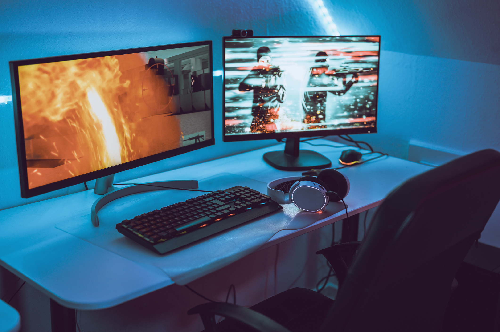 Big gaming computer set up with headset and two screens