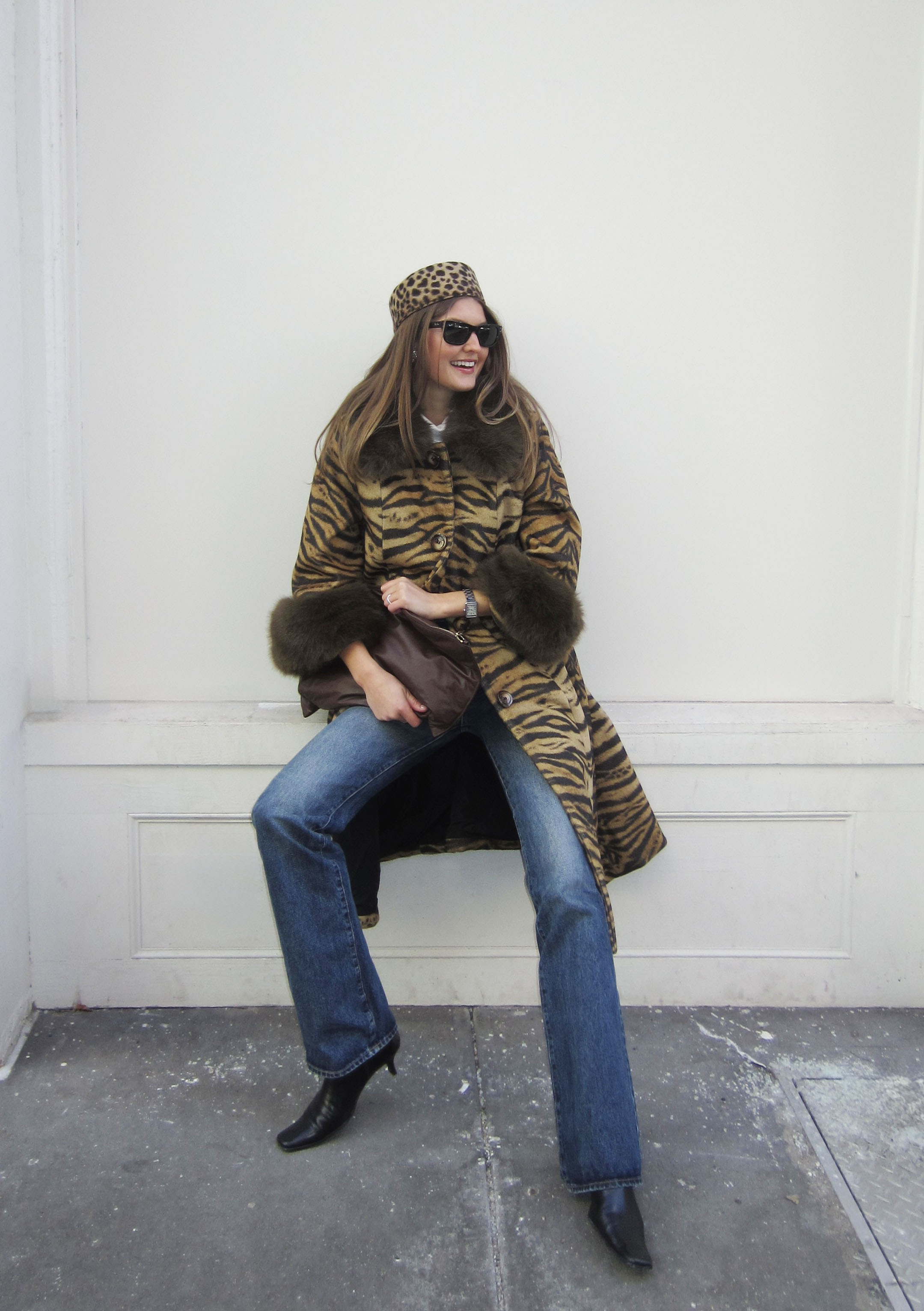 Sara Walker wearing a leopard print coat and jeans