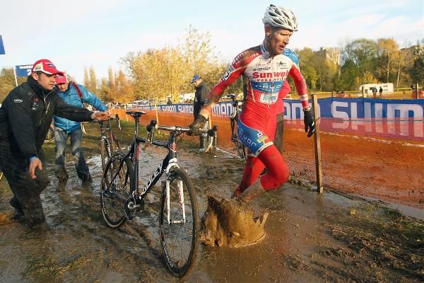 Vantornout splashes through the mud in the pits