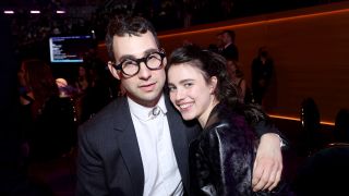 Jack Antonoff and Margaret Qualley posing at the Grammys